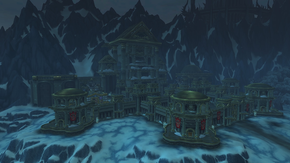 Wintergrasp keep amid looming mountains covered in snow