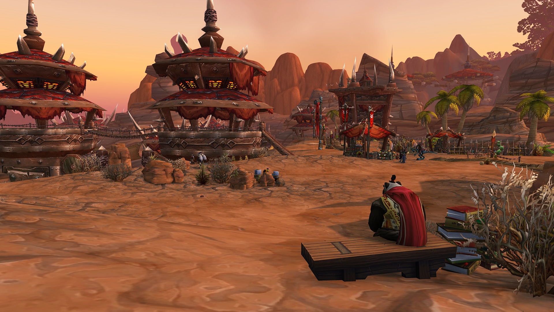 A pandaren sitting on a bench looking toward the flight towers