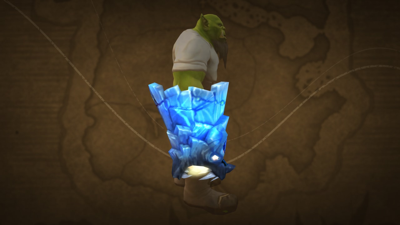 Gant de glace bleue en forme de tête de monstre dotée de crocs blancs et acérés