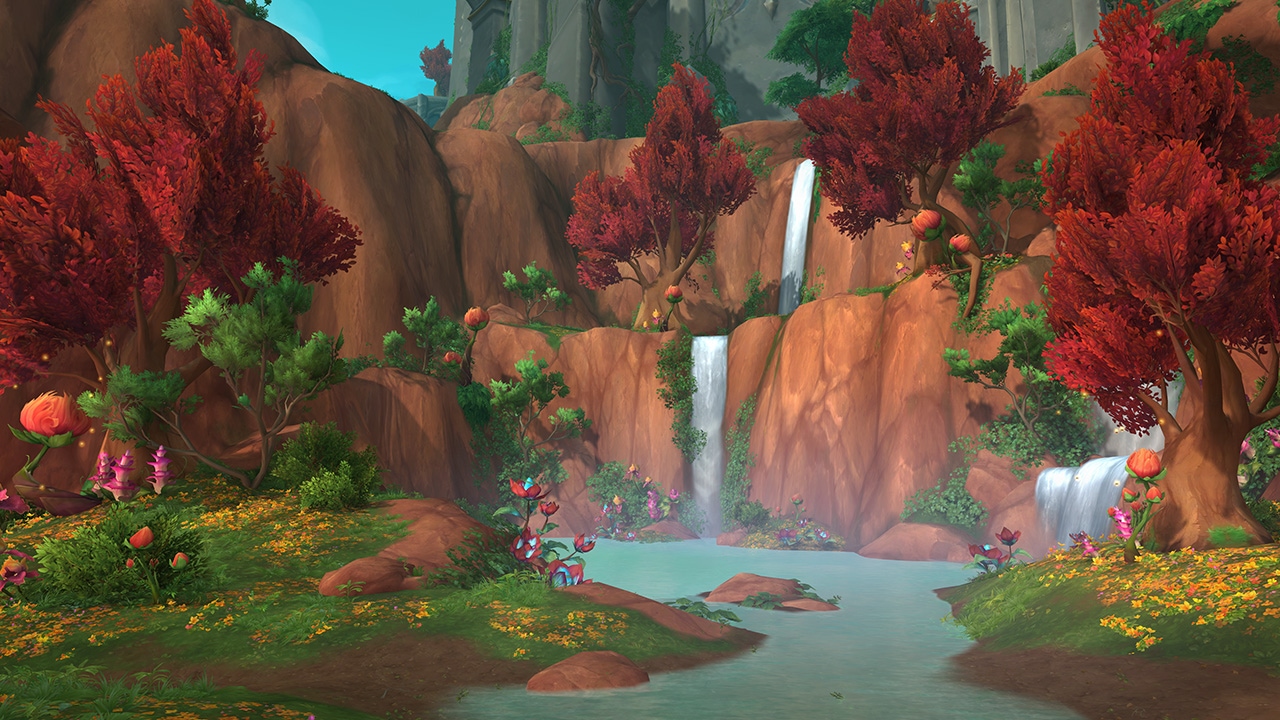 瀑布注入一條由緋紅樹木環繞的河流