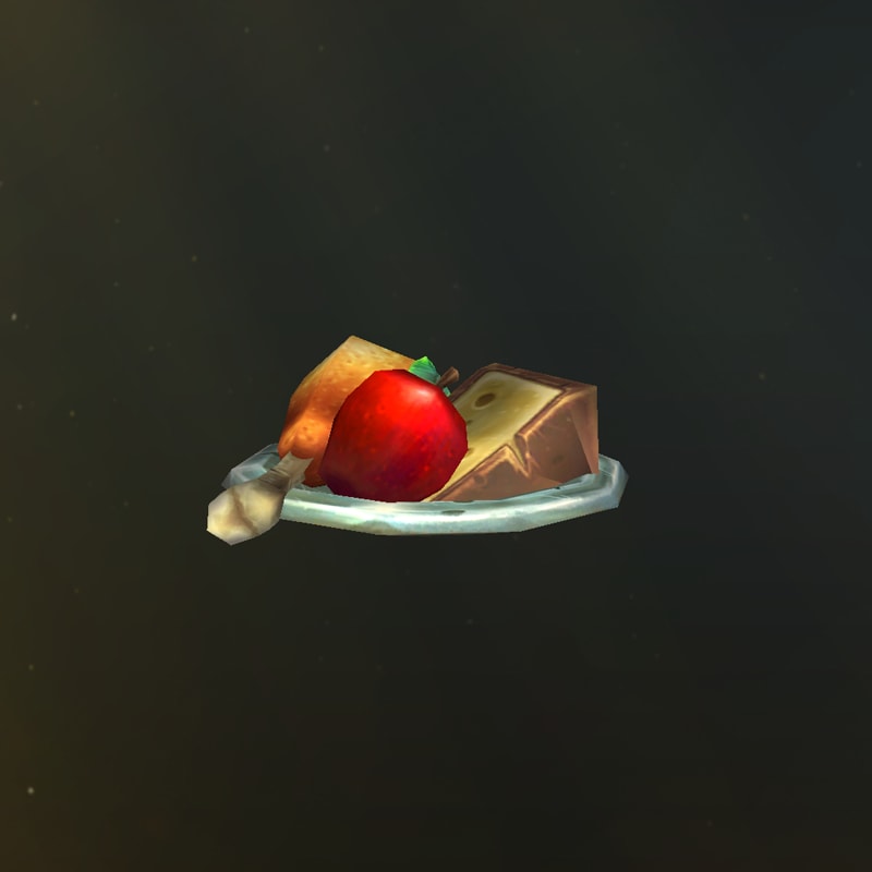 Ein Teller mit einem Hähnchenschenkel, einem Apfel, einem Stück Käse und einem Löffel