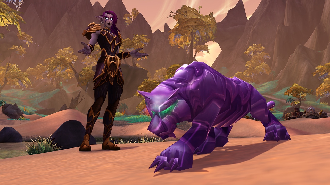 A Night elf stands next to a jewel-like purple cat pet.