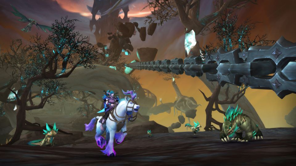 Una elfa de la noche atraviesa Las Fauces a caballo en una captura de pantalla de Cadenas de Dominación